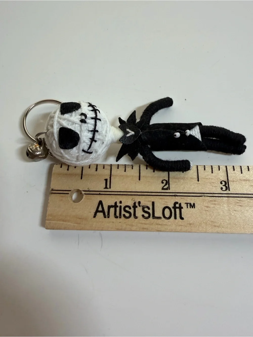 Jack Skellington and Sally string doll keychains. Backpack